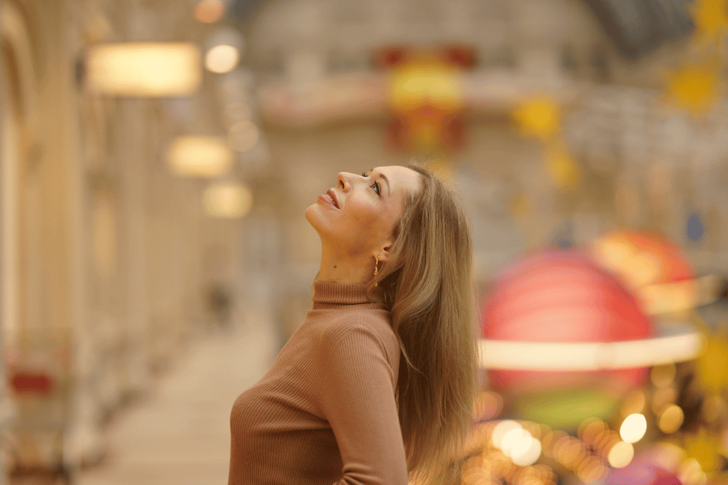 blond woman buyer smiling in shopping mall